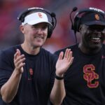 Lincoln Riley is shown coaching.