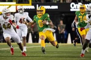 Dillon Gabriel runs with the ball during a game for Oregon.