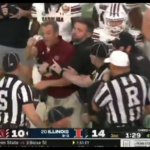 South Carolina head coach Shane Beamer restrained.