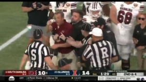 South Carolina head coach Shane Beamer restrained.