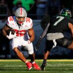 TreVeyon Henderson runs the ball against Oregon in 2024.