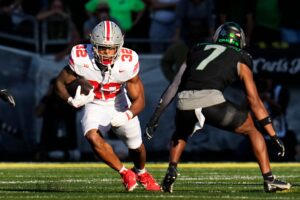 TreVeyon Henderson runs the ball against Oregon in 2024.