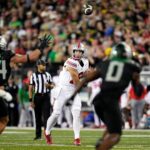 Will Howard throws a pass against Oregon in 2024.