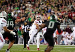 Will Howard throws a pass against Oregon in 2024.