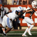 Keeshawn Silver tries to sack Quinn Ewers.
