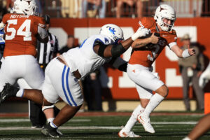 Keeshawn Silver tries to sack Quinn Ewers.