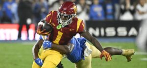 Zachariah Branch catches a pass in the USC-UCLA game.