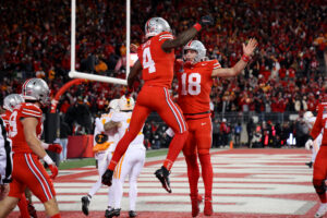 Jeremiah Smith and Will Howard celebrate a big touchdown.