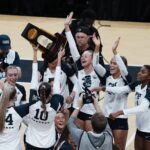 Penn State volleyball celebrates winning the national championship.