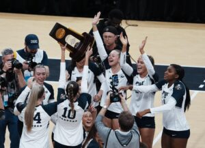 Penn State volleyball celebrates winning the national championship.