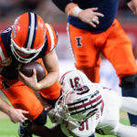 Illinois QB Luke Altmyer tackled.