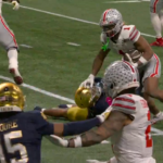 Quinshon Judkins delivers stiff-arm.