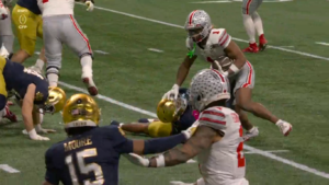 Quinshon Judkins delivers stiff-arm.