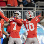 Ohio State DBs Jordan Hancock and Denzel Burke celebrate.