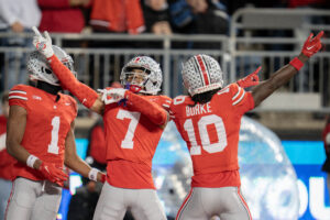 Ohio State DBs Jordan Hancock and Denzel Burke celebrate.