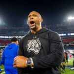 Eddie George celebrates a big win.