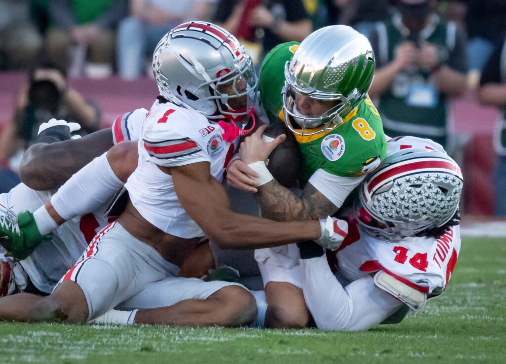 Dillon Gabriel gets tackled by Ohio State.