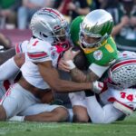 Dillon Gabriel gets tackled by Ohio State.