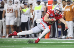 Ohio State QB Will Howard falls.