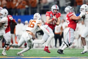 Ohio State QB Will Howard runs for a first down.
