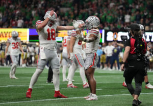Will Howard and Quinshon Judkins celebrate.