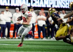 Will Howard runs the ball during the national title game.
