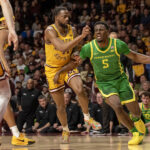 Oregon and Minnesota players in action.