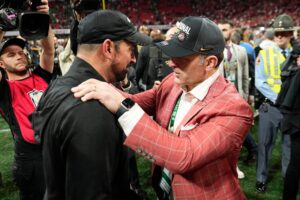 Ohio State head coach Ryan Day and AD Ross Bjork.