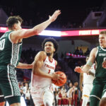 Michigan State and USC players in action.