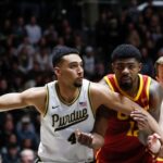 Purdue and USC players jostle for position.