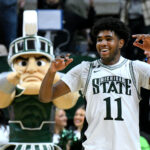 MSU's Jase Richardson with Sparty in the background.