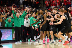 Michigan State celebrates buzzer beater.