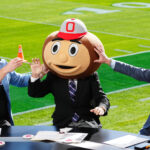 Lee Corso in Ohio State's headgear.