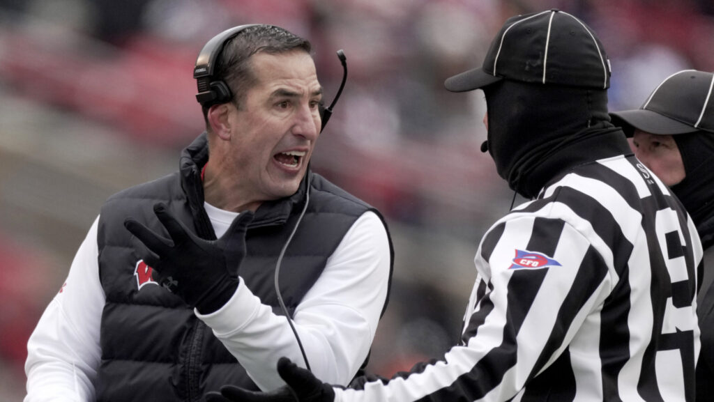 Wisconsin head coach Luke Fickell argues.