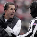 Wisconsin head coach Luke Fickell argues.