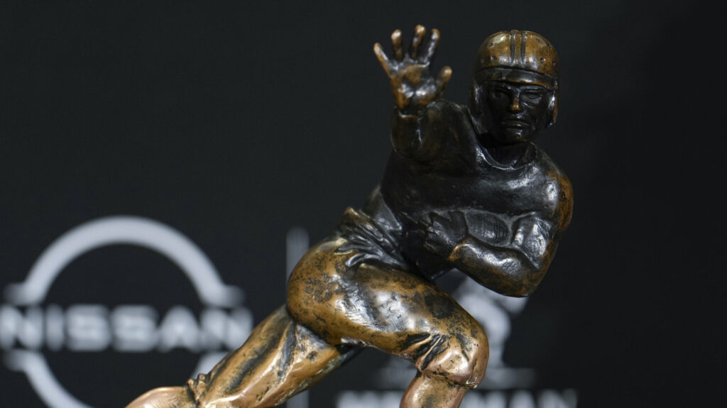 The Heisman Trophy is shown.