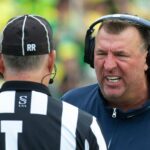 Illinois head coach Bret Bielema argues.