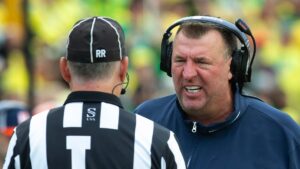 Illinois head coach Bret Bielema argues.