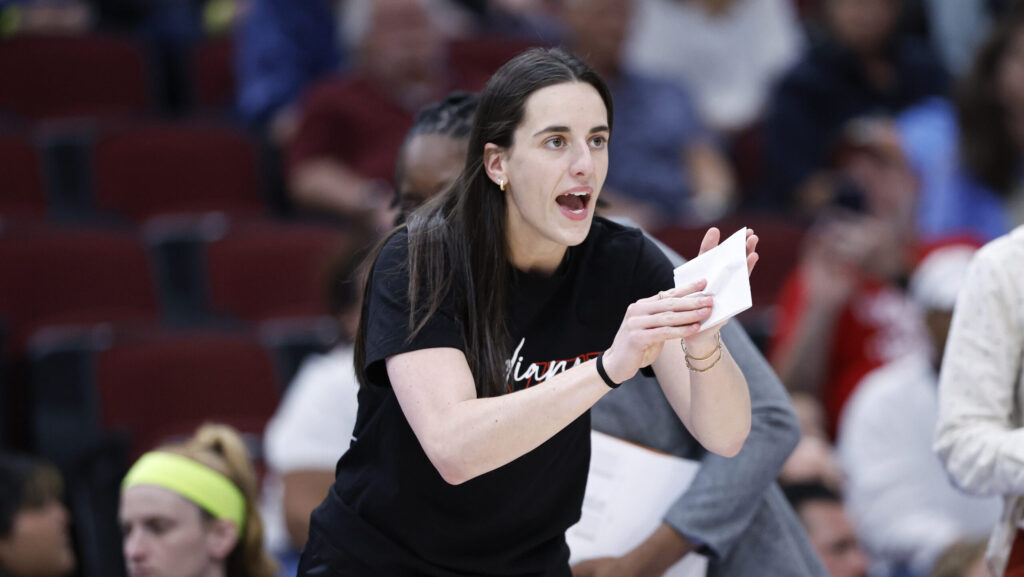 Indiana Fever star Caitlin Clark cheers her team on.