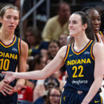 Caitlin Clark and her teammates react.