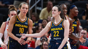 Caitlin Clark and her teammates react.