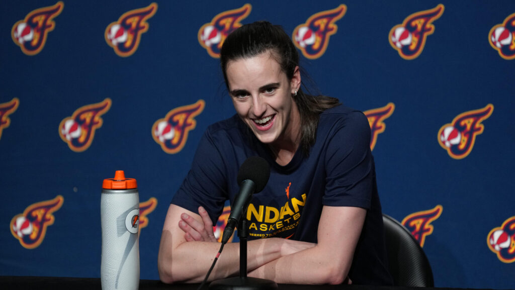 Caitlin Clark speaks to the media.