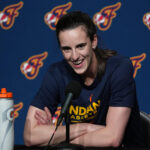 Caitlin Clark speaks to the media.
