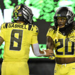 Oregon stars Jordan James and Dillon Gabriel celebrate.