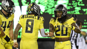 Oregon stars Jordan James and Dillon Gabriel celebrate.