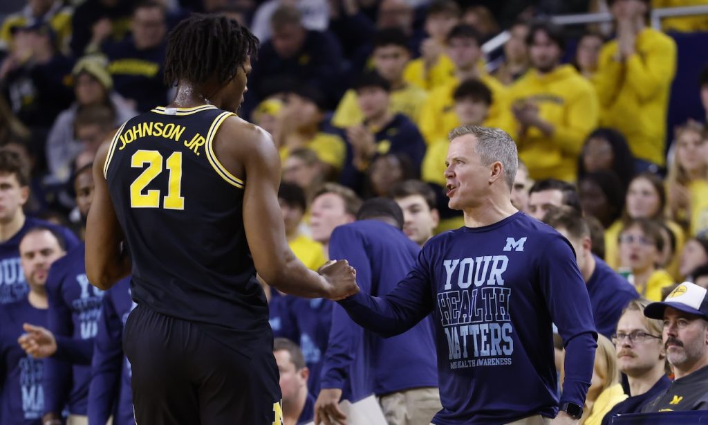 Michigan coach Dusty May and Morez Johnson Jr.