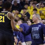 Michigan coach Dusty May and Morez Johnson Jr.