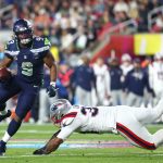 Kenneth Walker runs the ball in Super Bowl LX.