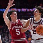 Illinois star Keaton Wagler drives against Indiana.