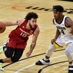 Nebraska Cornhuskers guard Kobe Webster controls the ball as Iowa Hawkeyes guard Ahron Ulis.